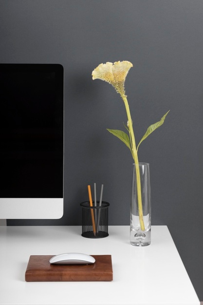 business-desk-concept-with-flower_23-2149073030